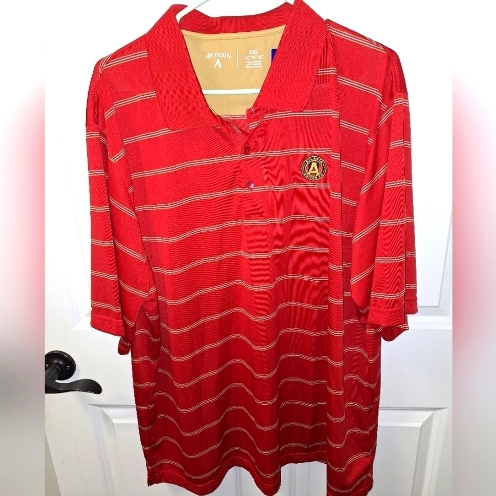 An Antigua Atlanta United short sleeve Polo in a men's size XXL. New with tags.